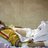 12-year old boy rests in a hospital bed after being wounded by a gunshot.